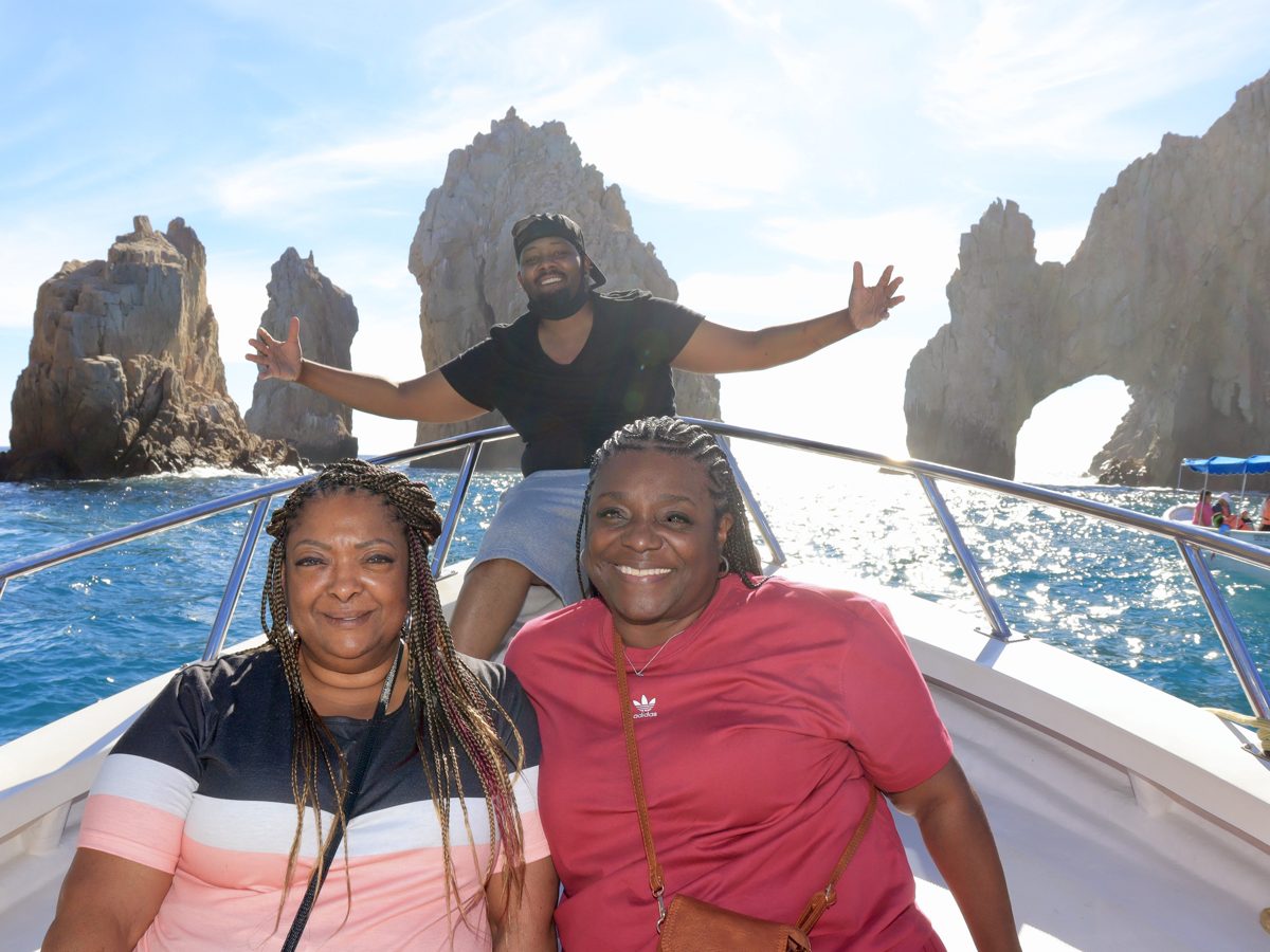 Ms. Williams and family on a boat at the Arch of Cabo San Lucas